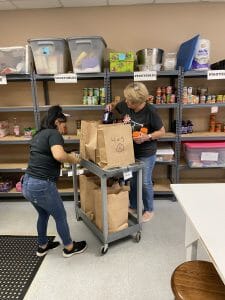 The Grace Place volunteers packing food