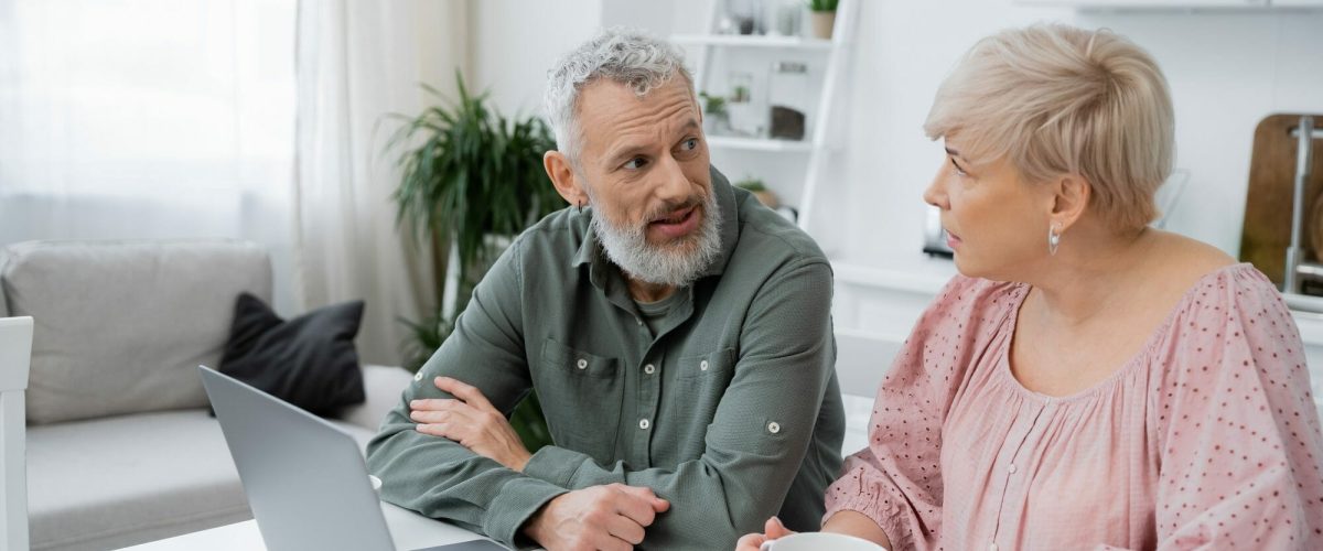 bigstock Middle Aged Couple Talking Nea 474947357