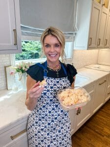 The Home Front How to Make Pimento Cheese in 10 minutes Jamie Tarence holding pimento cheese dish in hands in kitchen