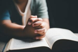 bigstock Little Boy Praying To God With 474874485