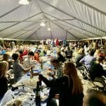 Greek festival tent with people eating