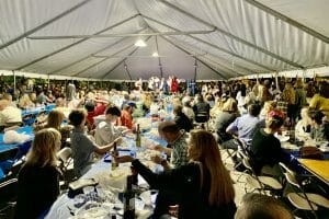 Greek festival tent with people eating