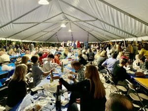 Greek festival tent with people eating