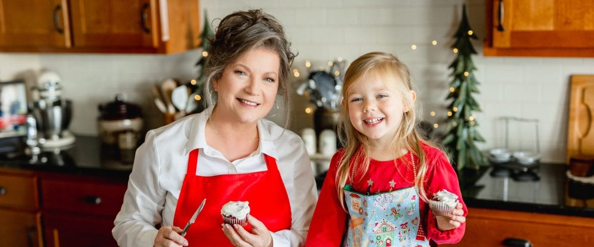 Danna with great niece in kitchen looking at camera