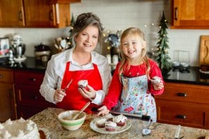 Danna with great niece in kitchen looking at camera