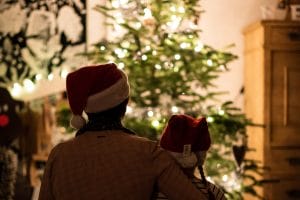 mom and child looking at christmas tree