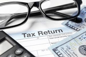 bigstock Tax return form glasses calc 180532114