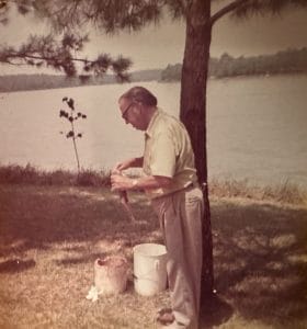 Walt's grandfather holding fish