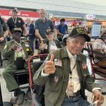 Veterans in chairs in airport