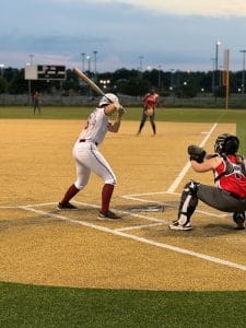 Rylee batting on softball field