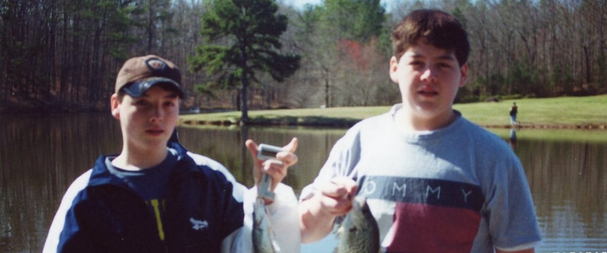 Dominic McMath fishing with his brother