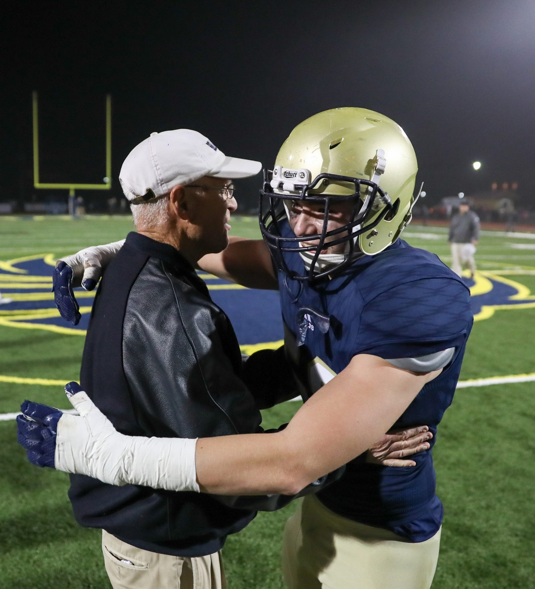 Coach Yancey hugging player