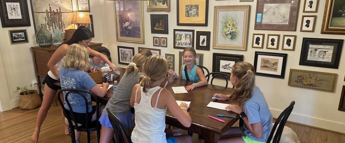 Small group of girls around table Small group of girls around table