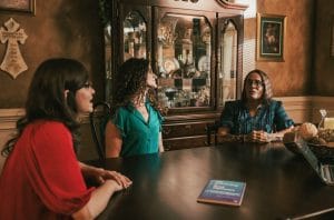 Group of ladies talking at table