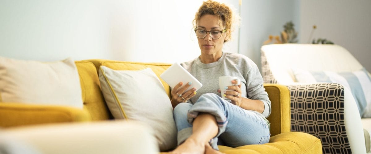 Woman reading on couch