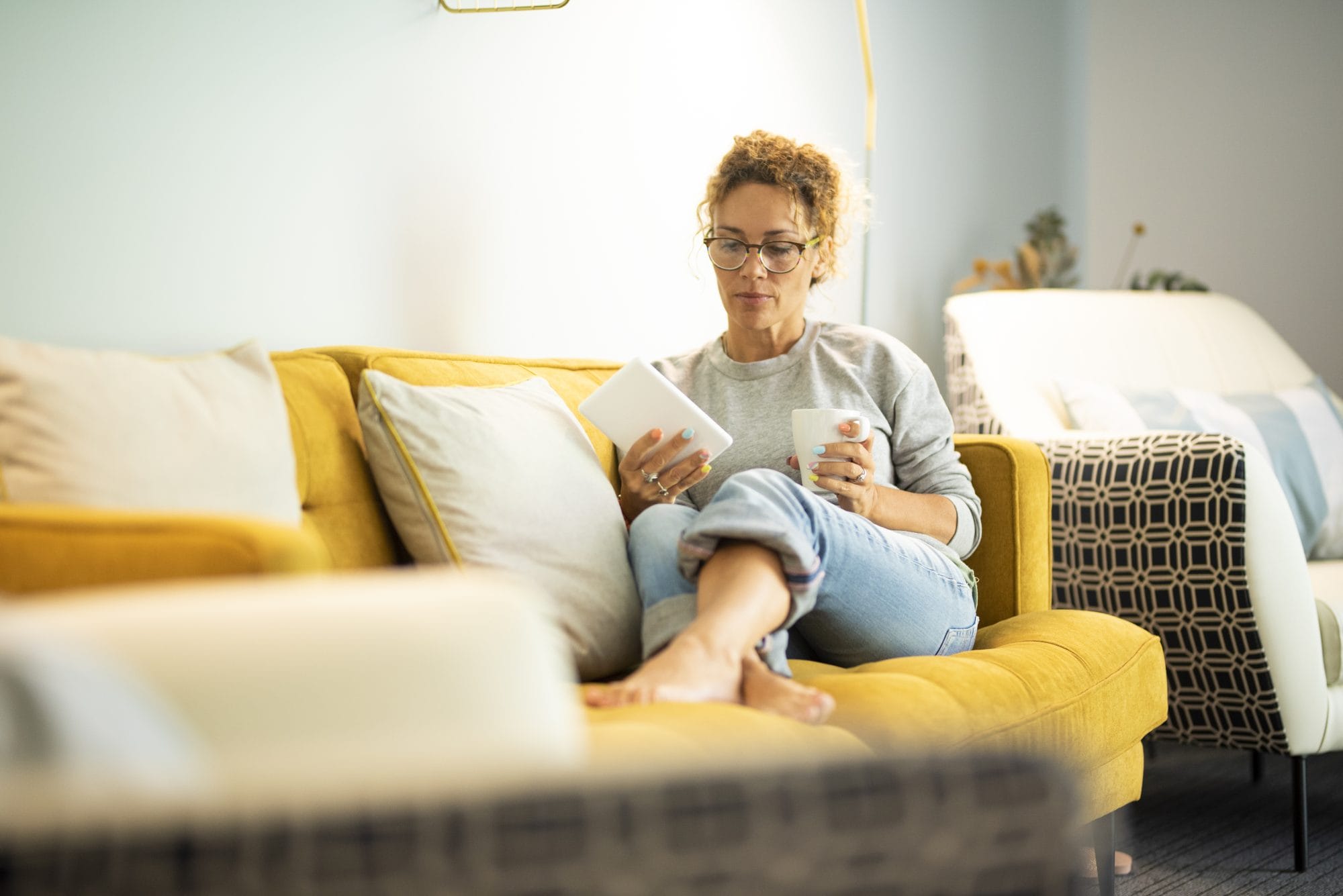 Woman reading on couch