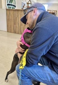 Talia hugs her foster dad