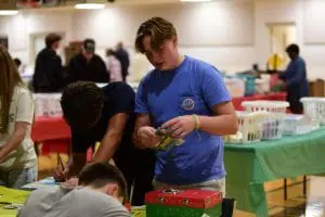 Boy packing shoebox Boy packing shoebox