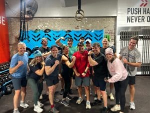 Jamie Warren with team working out