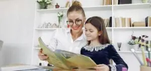 Woman and girl reading