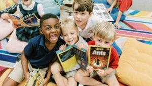 Westminster students holding books