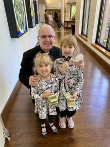 Pastor Helmers with children from the church