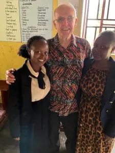 Pastor Helmers with children helped through Project HOPE looks lr