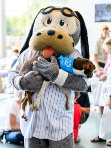 Babe Ruff holding dog